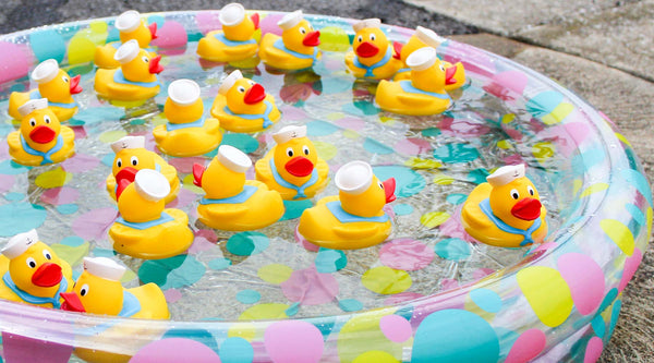 an inflatable pool filled with rubber ducks