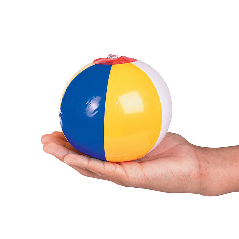 a hand holding a mini beach ball