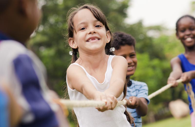 children playing tug of war